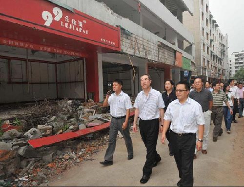 Henry Tang, second from left, visits the old town of Hanwang in Mianzhu on July 5th, 2009. Hanwang was completely devastated by the earthquake. [Photo courtesy of the Hong Kong SAR Government]