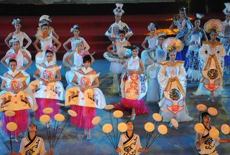 The actresses perform on the opening ceremony of the first Taihang Mountains Festival in Xingtai, a city of north China's Hebei Province, July 6, 2009. Plenty of cultural and trade promoting activities will be held during the festival. The Taihang Mountains runs down the eastern edge of the Loess Plateau covering Henan, Shanxi and Hebei provinces in China. (Xinhua Photo) 