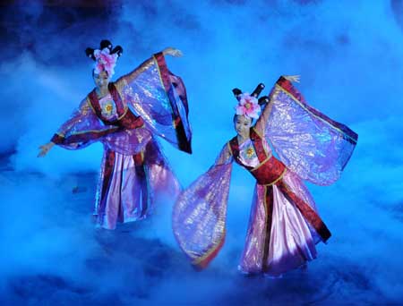The actresses perform on the opening ceremony of the first Taihang Mountains Festival in Xingtai, a city of north China's Hebei Province, July 6, 2009. Plenty of cultural and trade promoting activities will be held during the festival. The Taihang Mountains runs down the eastern edge of the Loess Plateau covering Henan, Shanxi and Hebei provinces in China. (Xinhua Photo) 