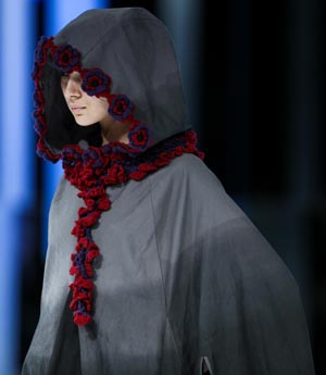 A model presents a creation by student from School of Continuing and Professional Studies of the Chinese University of Hong Kong (CUHKSCS) during a fashion show of Hong Kong Fashion Week for Spring/Summer 2010 in Hong Kong, south China, July 7, 2009. (Xinhua/Zhou Lei)