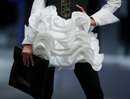 A model presents a creation by student from School of Continuing and Professional Studies of the Chinese University of Hong Kong (CUHKSCS) during a fashion show of Hong Kong Fashion Week for Spring/Summer 2010 in Hong Kong, south China, July 7, 2009. (Xinhua/Zhou Lei) 