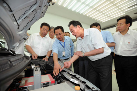 Wu Bangguo (2nd R), a member of the Standing Committee of the Communist Party of China Central Committee Political Bureau and chairman of the Standing Committee of the National People's Congress, visits the research department of Chery Automobile Co., Ltd. in east China's Anhui Province, July 3, 2009. Wu Bangguo paid a visit to Anhui between July 2 and 7. 