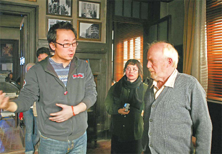Director Lu Chuan talks to John Paisley (right) during the shooting of 'City of Life and Death' in which Paisley plays the lead role of John Rabe.