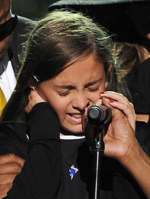 Michael Jackson's daughter Paris cries as she speaks at the memorial service for music legend Michael Jackson at the Staples Center in Los Angeles, California July 7, 2009. 