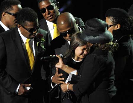 (L-R) Members of the Jackson family, Marlon Jackson, Jermaine Jackson, Tito Jackson, Randy Jackson, Paris Katherine Jackson, Janet Jackson and Rebbie Jackson eulogize during Michael Jackson's public memorial service held at Staples Center in Los Angeles July 7, 2009.