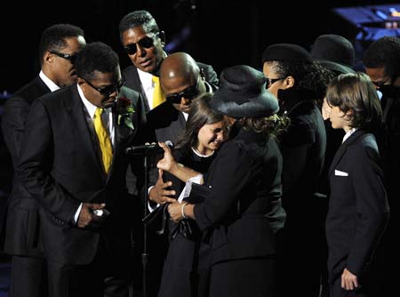 (L-R) Members of the Jackson family, Marlon Jackson, Jermaine Jackson, Tito Jackson, Randy Jackson, Paris Katherine Jackson, Janet Jackson and Rebbie Jackson eulogize during Michael Jackson's public memorial service held at Staples Center in Los Angeles July 7, 2009.