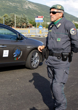 An Italian security member guards near the conference site of the upcoming G8 summit in L'aquila, Italy, on July 7, 2009. [Zhang Yuwei/Xinhua]