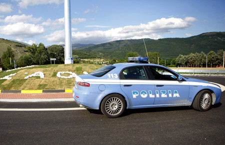 A police car is parked near the conference site of the upcoming G8 summit in L'aquila, Italy, on July 7, 2009. [Zhang Yuwei/Xinhua]