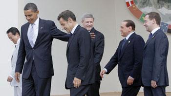 From left to right: Japan&apos;s Prime Minister Taro Aso, U.S. President Barack Obama, France&apos;s President Nicolas Sarkozy, Canada&apos;s Prime Minister Stephen Harper, Italy&apos;s Prime Minister Silvio Berlusconi and Russia&apos;s President Dmitry Medvedev arrive for a group photograph at the G8 summit in L&apos;Aquila, Italy on Wednesday. [Jason Reed/CCTV/Reuters] 