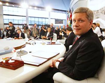 Canada's Prime Minister Stephen Harper at the opening of a round table session at the G8 summit in L'Aquila, Italy on Wednesday. [Chris Wattie/CCTV/Reuters]