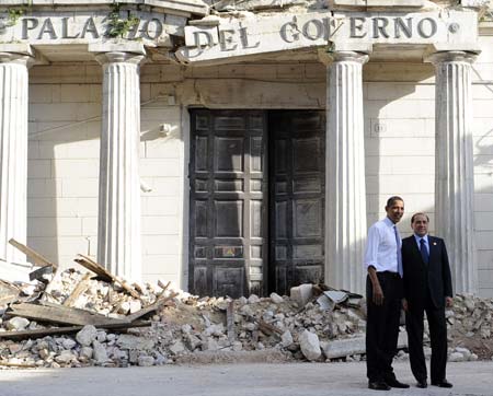 Italian Prime Minister Silvio Berlusconi (R) and U.S. President Barack Obama visit the historical center of L'Aquila destroyed by the earthquake on April 6 in L'Aquila, Italy, July 8, 2009, first day of the G8 Summit.[Pool/Xinhua]