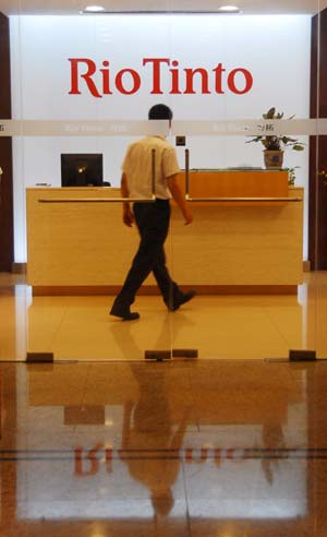 A man walks inside the Rio Tinto Ltd. Office in Shanghai, east China, July 9, 2009. Four employees of the Anglo-Australian miner Rio Tinto Ltd. have been arrested over alleged stealing of China's state secrets, including Stern Hu, general manager of the company's Shanghai offic. The four people, including Hu, had been detained by China's security authorities Sunday evening. [Xinhua]