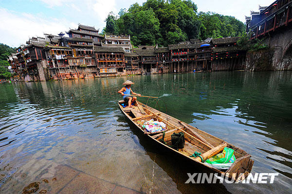 A selection of pictures published on Xinhuanet.com on July 8 exhibit the beauty of the ancient town of Phoenix, which is located in the Phoenix County in the Tujia and Miao ethnic minority Autonomous Prefecture in Hunan province. Built adjacent to the Tuo River, it is a national historical and cultural town with a long history and many places of interest. The town has been named 'the most beautiful whistle stop' in china. [Photo: Xinhuanet]