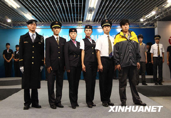 Models show the new uniforms of workers on subway Line 4 in Beijing on July 8, 2009. The uniforms, whose predominant color is navy blue, are modern and simple in style. The new 28-kilometer line will start operating at the end of September. [Photo: Xinhuanet]