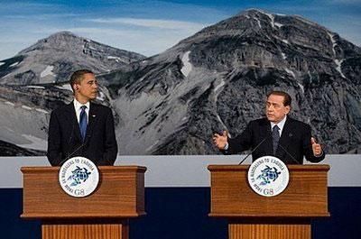 Italian Prime Minister Silvio Berlusconi (R) speaks alongside US President Barack Obama during a press conference at the Group of Eight (G8) summit in L&apos;Aquila, central Italy. [Saul Loeb/CCTV/AFP] 