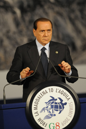 Italian Prime Minister Silvio Berlusconi addresses the closing press conference of the Group of Eight (G8) summit in L'Aquila, central Italy, July 10, 2009. The three-day G8 summit and its related meetings ended here on Friday. [Zeng Yi/Xinhua]