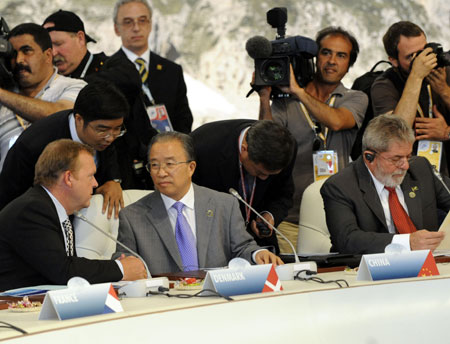 Chinese State Councilor Dai Bingguo (2nd L, front), on behalf of Chinese President Hu Jintao, attends the Working Session on Food Security, part of the Group of Eight (G8) meetings, in L'Aquila, Italy, July 10, 2009. Leaders or representatives from the G8 industrialized countries, other invited countries and world organizations attended the Working Session on Food Security in L'Aquila on Friday, the last day of the 2009 G8 summit and its related meetings. [Zeng Yi/Xinhua]