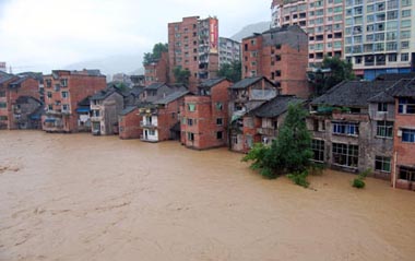 Photo taken on July 12, 2009 shows the flooded streets at the Nanba Town of Yihan County in Dazhou City, southwest China's Sichuan Province. [Xinhua]