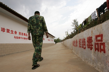 A man walks in a factory-turned-rehab-center in Jinghong City of drug-afflicted Yunnan Province where drug addicts live normal lives and are treated fairly.