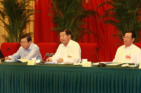 Jia Qinglin (C), chairman of the National Committee of the Chinese People's Political Consultative Conference, addresses a consultative conference on sustainable development in Beijing, capital of China, on July 13, 2009. [Xinhua]