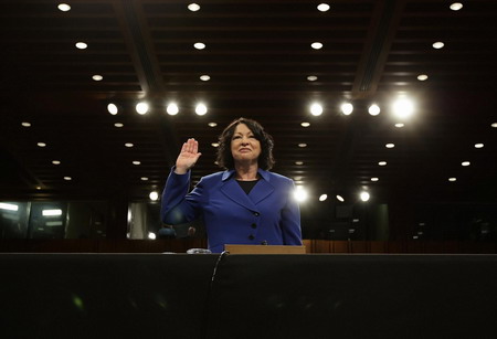US Supreme Court nominee Judge Sonia Sotomayor is sworn-in to testify during her US Senate Judiciary Committee confirmation hearings on Capitol Hill in Washington July 13, 2009. [China Daily/Agencies] 