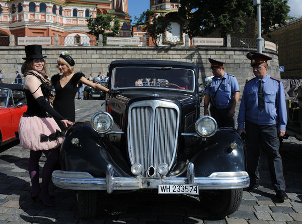 A car seen on Vasilievsky Spusk next to Red Square before the start of a rally in Moscow, Russia, July 12, 2009. Classic cars rally is held due to FIVA rules and only original cars produced before 1979 are accepted. [CFP]