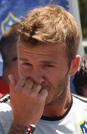 David Beckham speaks to the media following practice with the Los Angeles Galaxy for the first time this year following the extension of his loan with Italy's AC Milan at The Home Depot Center in Carson, California. Beckham and Landon Donovan practiced together for the first time this season on Monday, saying their war of words is over as they settle down to focus on football. (Xinhua/Reuters Photo) 