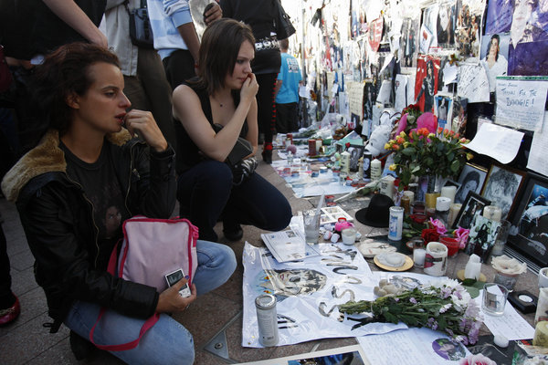 Fans of Michael Jackson react as hundreds gathered at the O2 arena in London for a tribute celebration, Monday, July 13, 2009. Monday was to have been the opening night of Michael Jackson concerts at the arena but he died on June 25.