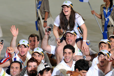 Members of Australian delegation enter the stadium at the opening ceremony of the 18th Maccabiah Games, known as the Jewish Olympics, in Ramat Gan stadium near Tel Aviv, Israel, July 13, 2009. Over 7,000 athletes from 51 countries and regions will take part in the games held every four years since 1932. (Xinhua/Yin Bogu) 