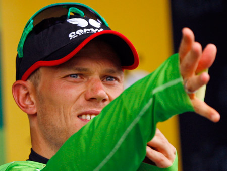 Cervelo Test Team rider Thor Hushovd of Norway wears the sprinter's green jersey on the podium after the tenth stage of the 96th Tour de France cycling race between Limoges and Issoudun, July 14, 2009.(Xinhua/Reuters) 