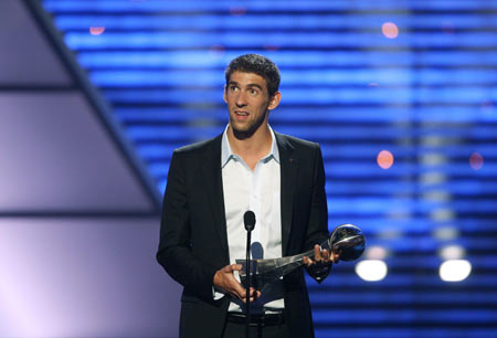 U.S. swimmer Michael Phelps reacts after receiving the Best Male Athlete of the Year award at the taping of the 2009 ESPY Awards in Los Angeles July 15, 2009. The awards show will be telecast on ESPN July 19. [Xinhua/Reuters] 