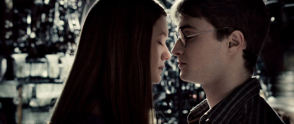 In this image released by Warner Bros., Bonnie Wright as Ginny Weasley, left, and Daniel Radcliffe as Harry Potter are shown in a scene from 'Harry Potter and the Half-Blood Prince'.