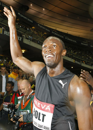Jamaica's Usain Bolt celebrates after winning the men's 100m event of the Paris IAAF Golden League meeting at the Stade de France in Saint-Denis, north of Paris, Friday, July 17, 2009. [Zhang Yuwei/Xinhua]