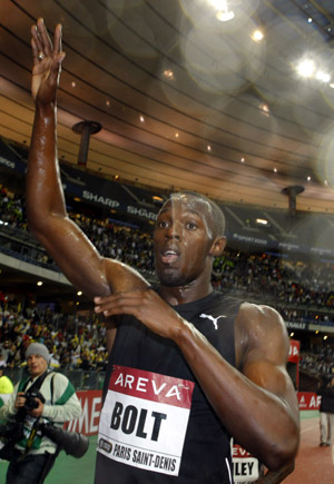 Jamaica's Usain Bolt reacts after winning the men's 100m event of the Paris IAAF Golden League meeting at the Stade de France in Saint-Denis, near Paris. [Zhang Yuwei/Xinhua]