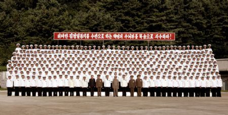 Photo released by Korean Central News Agency on July 17, 2009 shows Kim Jong Il (C Front), top leader of the Democratic People's Republic of Korea (DPRK), poses for a group photo with naval officers and soldiers in an undisclosed location. Kim Jong Il inspected Unit 597 of the Navy of the Korean People's Army in recent days. [Xinhua]