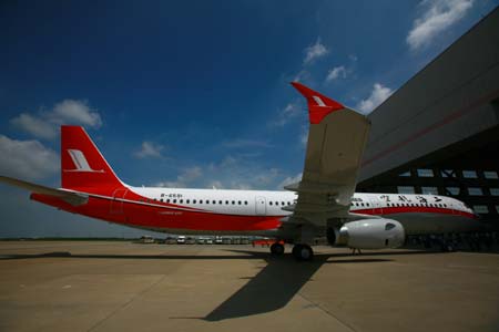 Photo taken on July 19, 2009 shows an Airbus A321-200 plane of Shanghai Airlines at Pudong International Airport in Shanghai, east China. Shanghai Airlines' first plane of the kind flew into Shanghai from Hamberg of Germany on Sunday. (Xinhua/Xia Benjian)