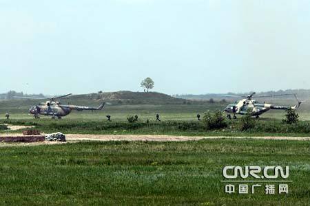 Chinese and Russian armed forces conduct joint military exercises to defend against terrorism on Saturday, July 18, 2009 at a military training base in Shenyang, capital of northeast China's Liaoning Province. 