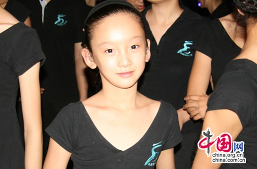 Wang Yimei (hearing impaired), 12, is the youngest performer in the troupe. She can speak after special training.