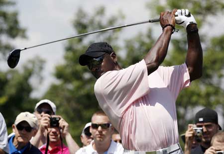 Former NBA basketball player Michael Jordan tees off during the inaugural Mike Weir Charity Classic golf tournament at Glen Abbey Golf Club in Oakville, Ontario July 20, 2009.