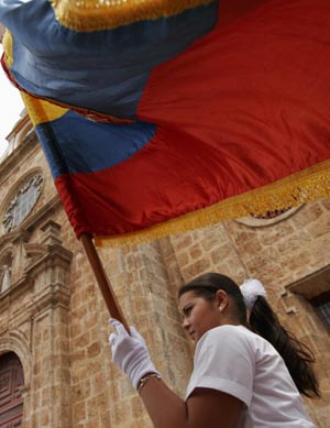 A Colombian girl waves the national flag to celebrate the 199th anniversary of the nation's independence in the northern city of Cartagena, on July 20, 2009.