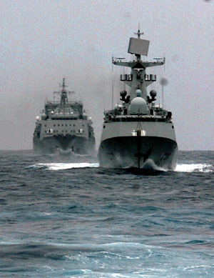 Chinese naval "Xuzhou" missile frigate (front) and "Qiandaohu" supply ship sail in the Indian Ocean on July 22, 2009. The third batch of Chinese naval escort fleets sailed across the Malacca strait and entered the Indian Ocean on Beijing time July 22. (Xinhua/Guo Gang)