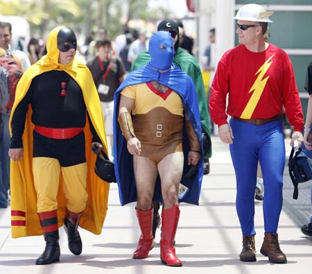 Visitors dressed as DC Comics' (L to R) Hourman, Atom and Flash walk during the 40th annual Comic Con Convention in San Diego July 24, 2009. The convention runs from July 23 to July 26.