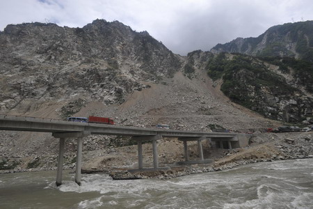 This May 16, 2009 file photo shows the Chediguan Bridge, an artery lifeline in Wenchuan County, epicenter of last year's May 12th earthquake, in southwest China's Sichuan province. [Xinhua]