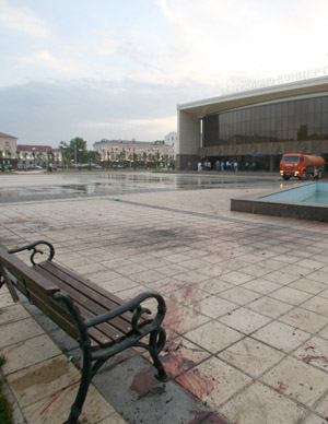 The floor is stained with blood at a square, the site of a suicide bomber attack, in front of a concert hall in Grozny July 26, 2009. 