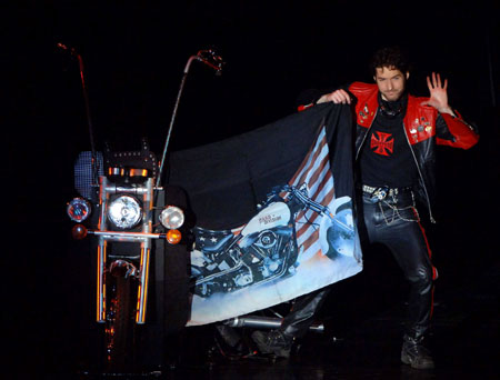 Argentine magician Latko performs during the stage competition of the 24th World Magic Championships of the International Federation of Magic Societies (FISM) held in Beijing, capital of China, on July 27, 2009. [Gong Lei/Xinhua]