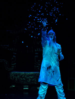 Chinese magician Zhang Chao performs during the stage competition of the 24th World Magic Championships of the International Federation of Magic Societies (FISM) held in Beijing, capital of China, on July 27, 2009. [Gong Lei/Xinhua] 