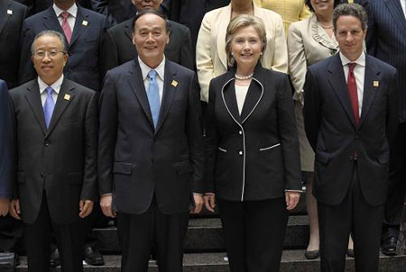 Chinese Vice Premier Wang Qishan (2nd L), State Councilor Dai Bingguo (1st L), U.S. Secretary of State Hillary Clinton (2nd R) and U.S. Treasury Secretary Timothy Geithner (1st R) pose for a photo before the opening of the China-U.S. Strategic and Economic Dialogue (S&ED) in Washington, the United States, July 27, 2009. The China-U.S. Strategic and Economic Dialogue (S&ED), the first of its kind between the world&apos;s biggest developing country and biggest developed country, opened here on Monday. (Xinhua/Zhang Yan)