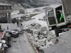 Workers rush to clear collapsed bridge in Wenchuan