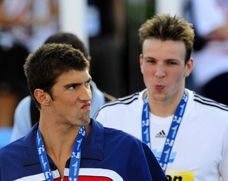 Phelps (front) and Biedermann are at the awarding ceremony of the world swimming championships, July 28, 2009.