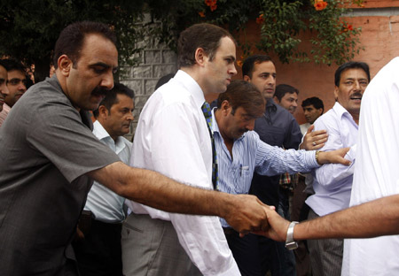 India-controlled Kashmir's top administrative official, Chief Minister Omar Abdullah (C), walks to the Governor House to offer his resignation in Srinagar, summer capital of Indian-controlled Kashmir, July 28, 2009. Omar Abdullah announced on Tuesday to resign from the post in the floor of the assembly house following allegations leveled by an opposition member of his involvement in the infamous sex scandal that rocked the region in 2006. (Xinhua/Javed Dar)